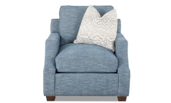 Classic blue chair with scalloped track arms and nail head trim.