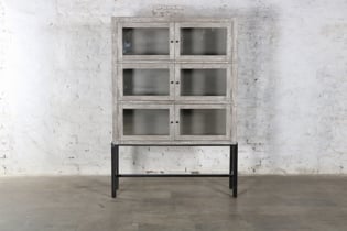 Handcrafted display cabinet in a Gray wash finish on top of a black iron stand.