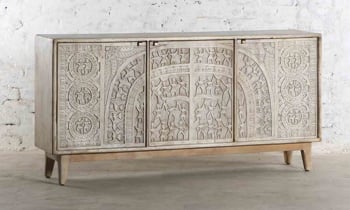The Penna Media Cabinet has a bleached finish with intricate tribal carvings.