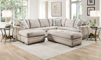 Tan fabric upholstered reversible chair sectional couch.