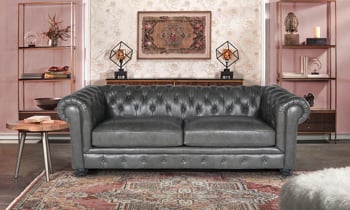 Carson Gray leather chesterfield sofa with roll arms.