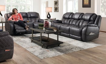 Power reclining living room set includes sofa, loveseat and recliner in a dark steel gray fabric.