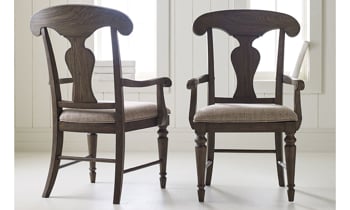 Slightly distressed dark brown dining chairs from Legacy Classic.