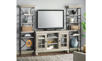 3-piece contemporary entertainment unit with 66-inch wide console and two 79.5" tall storage shelves in weathered wood finish with TV and accessories.