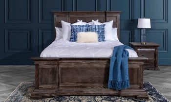 King size mansion panel bed in a distressed wood finish.