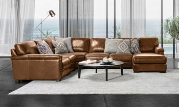 147 inch brown leather sectional made with hardwood frames and Pirelli weebed support systems.