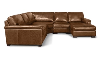 Closeup detail image of the brown top grain leather upholstered layover armrest and solid wood feet of the Medici Chestnut Sectional.