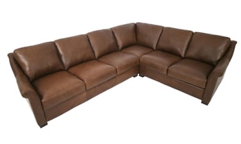 Taupe top-grain leather sectional provides plenty of seating.