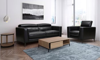 Black leather couch with adjustable headrests.