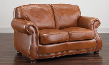American-made 66-inch loveseat in top-grain cognac leather with nailhead trim