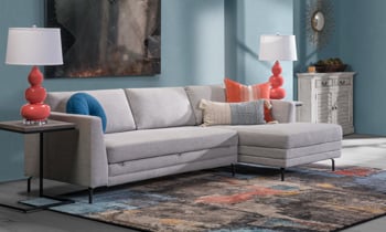 Sleeper sectional with right facing chaise in a neutral Gray.