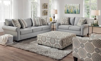 Claiborne living room collection shows the sofa, loveseat, chair and ottoman.