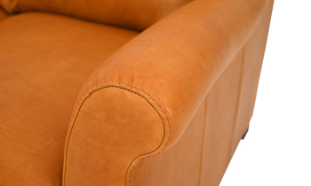 Bench-made in Italy, this luxurious loveseat in camel color would look great in your living room.