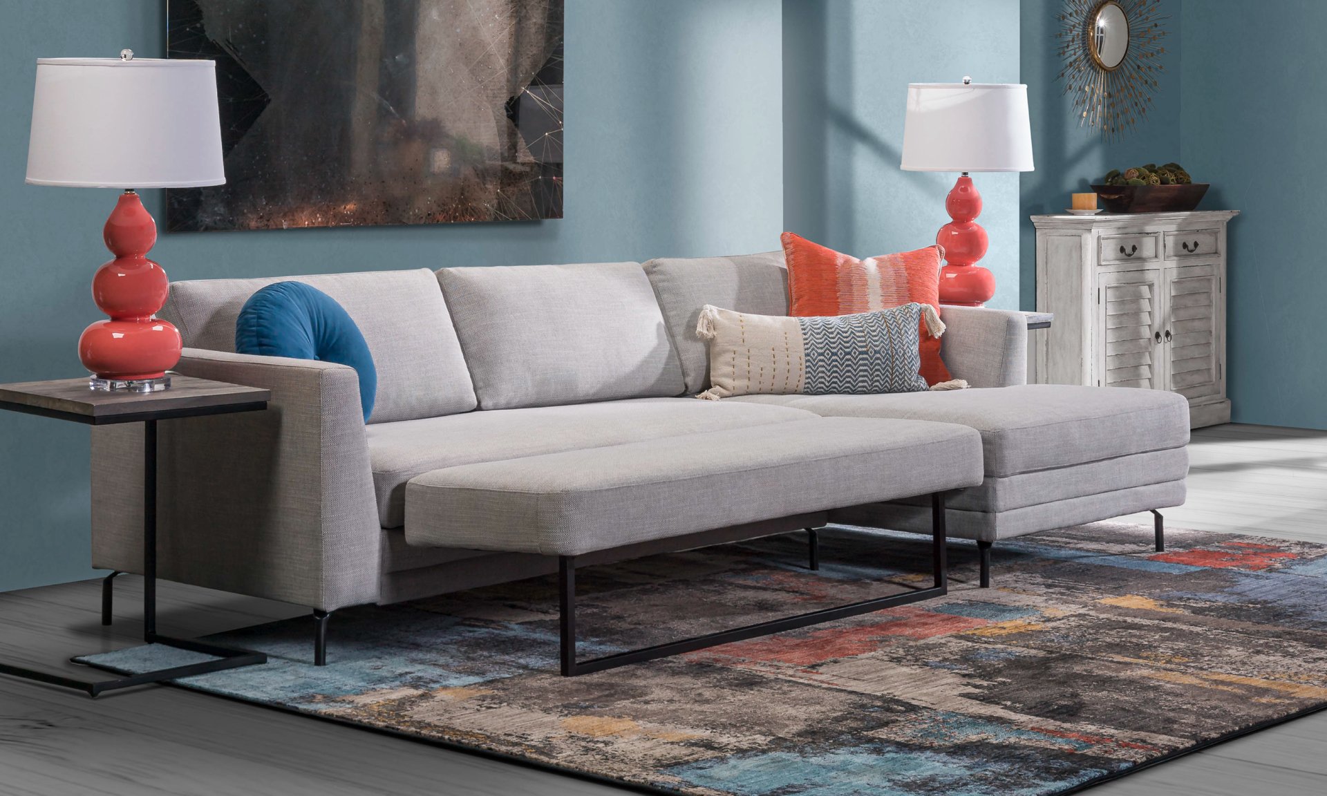 Sleeper sofa in a gray tone that can easily accommodate guests who stay over.